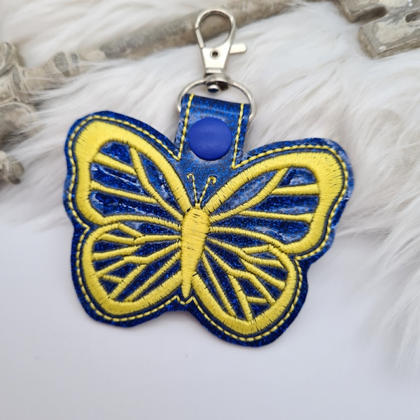 Taschenanhänger / Taschenbaumler Schmetterling blau/gelb